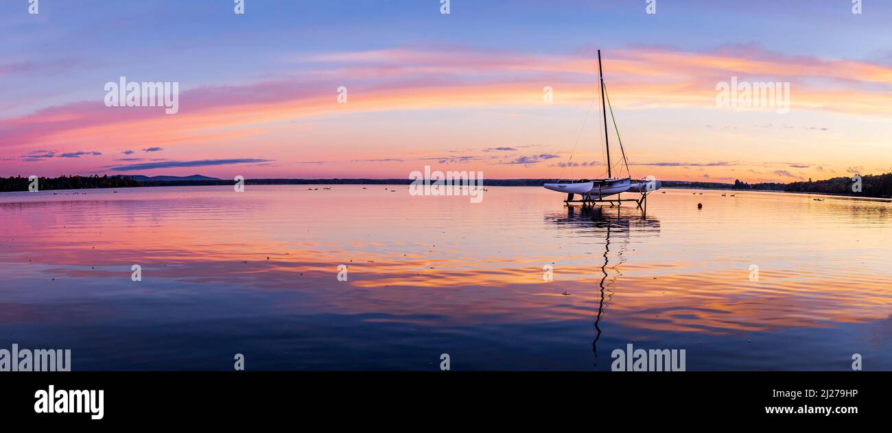 Trimaran dry docked on Brome Lake at sunrise, Quebec Canada Stock Photo