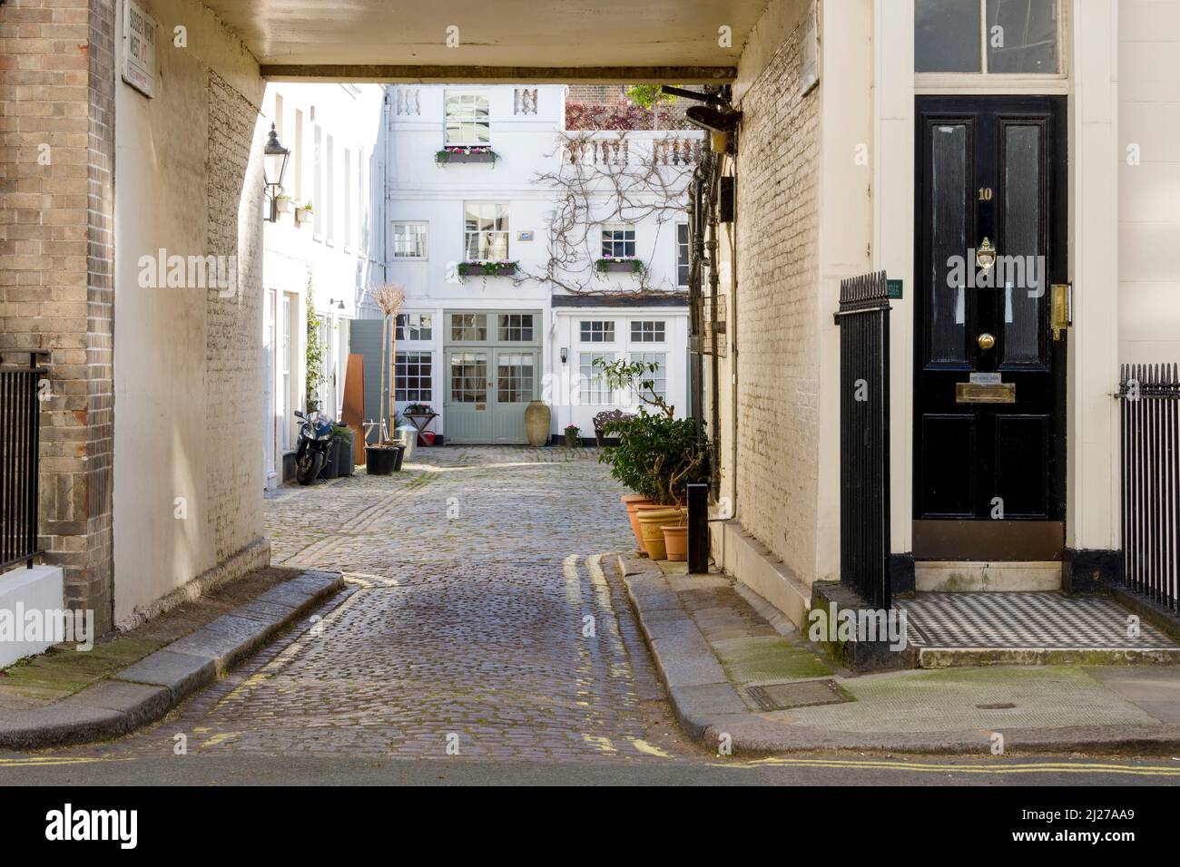 Characterful and charming Sussex Mews West, a small cobbled residential cul-de-sac near Hyde Park in London. Stock Photo