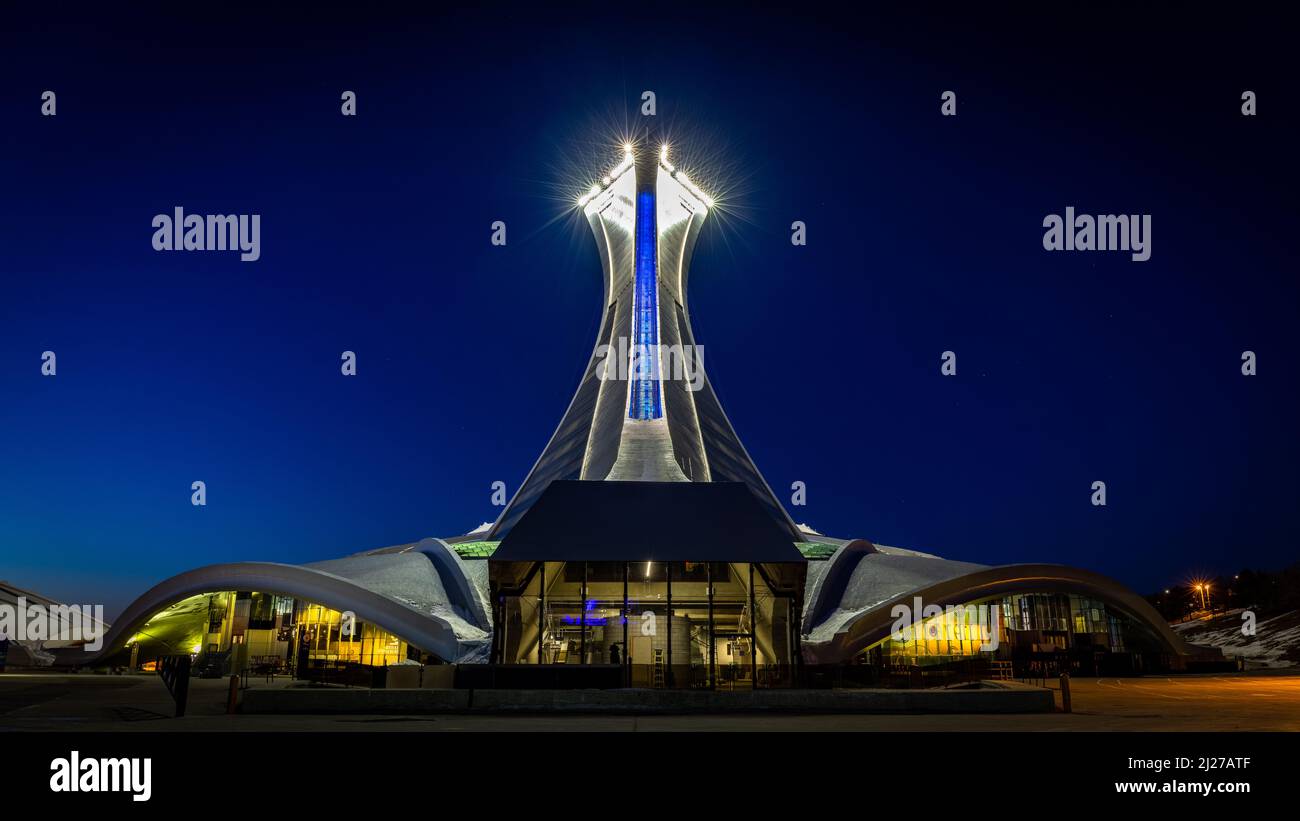 The inclined tower of Montreal's 1976 Olympic Stadium seen at night. Stock Photo