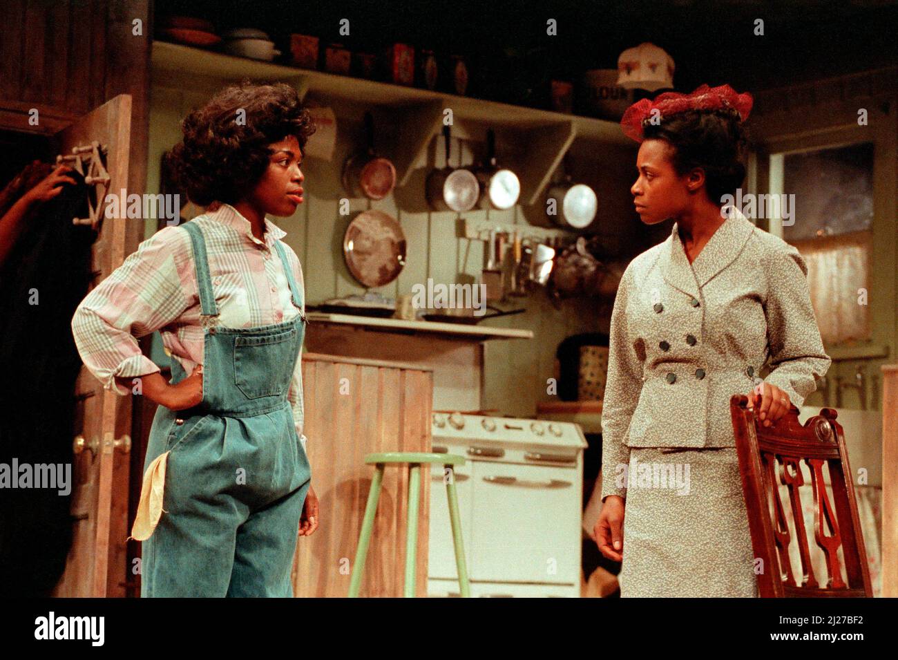 l-r: Valerie Buchanan (Ruth Younger), Marcia Myrie (Beneatha Younger) in A RAISIN IN THE SUN by Lorraine Hansberry at the Palace Theatre, Watford, England  15/11/1989                  design: Martin Johns  lighting: Leonard Tucker  director: Lou Stein Stock Photo
