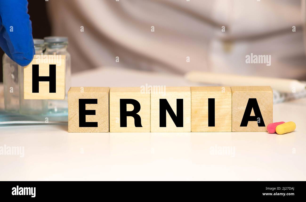 Hernia - words from wooden blocks with letters, medical condition hernia concept, white background. Stock Photo