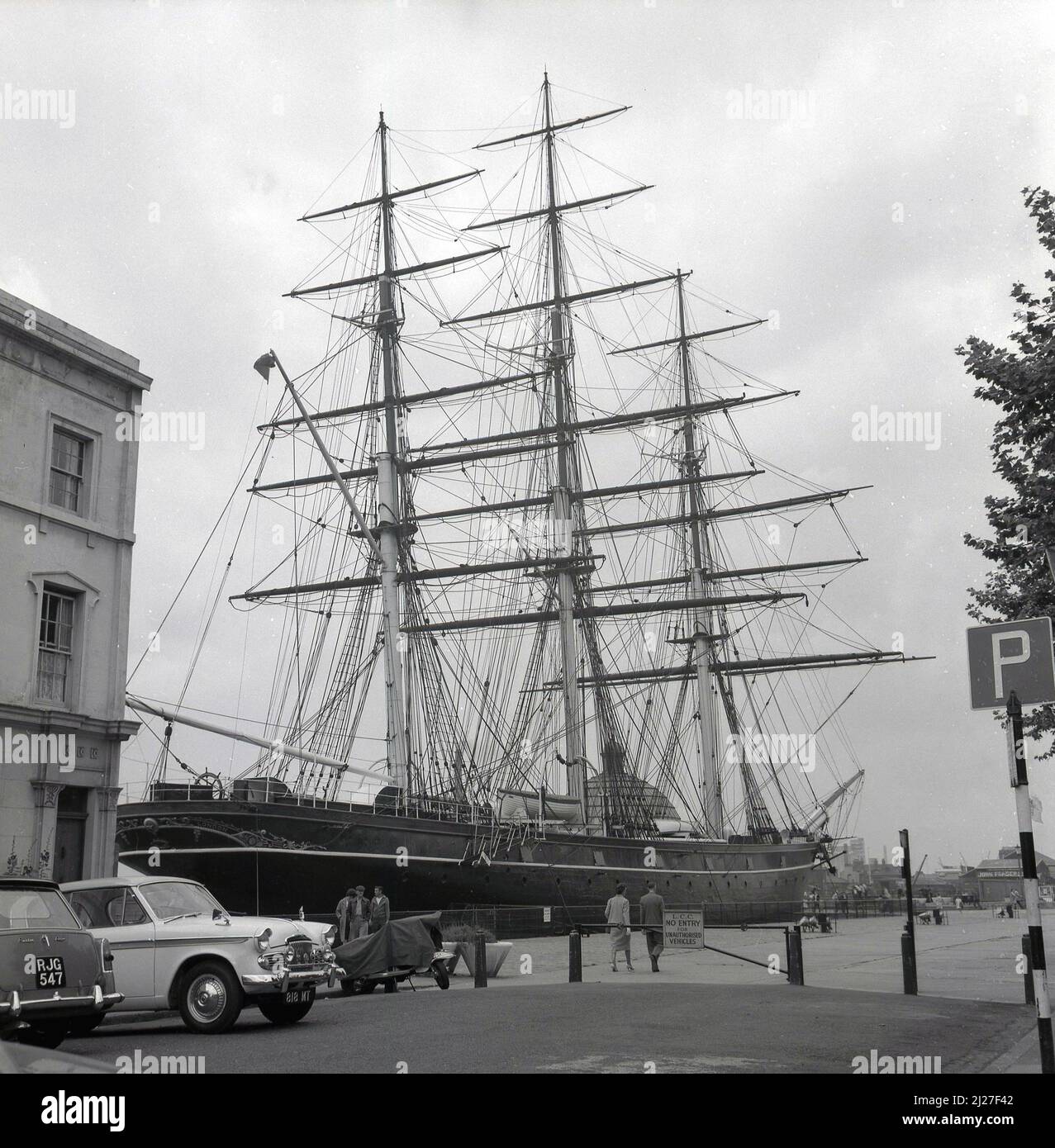 1950s, historical, the Cutty Sark moored at Greenwich, South-East London, England, UK. Built in Scotland in 1869 to carry tea back from China, the three-masted clipper ship was famous for its record-breaking passages. Stock Photo
