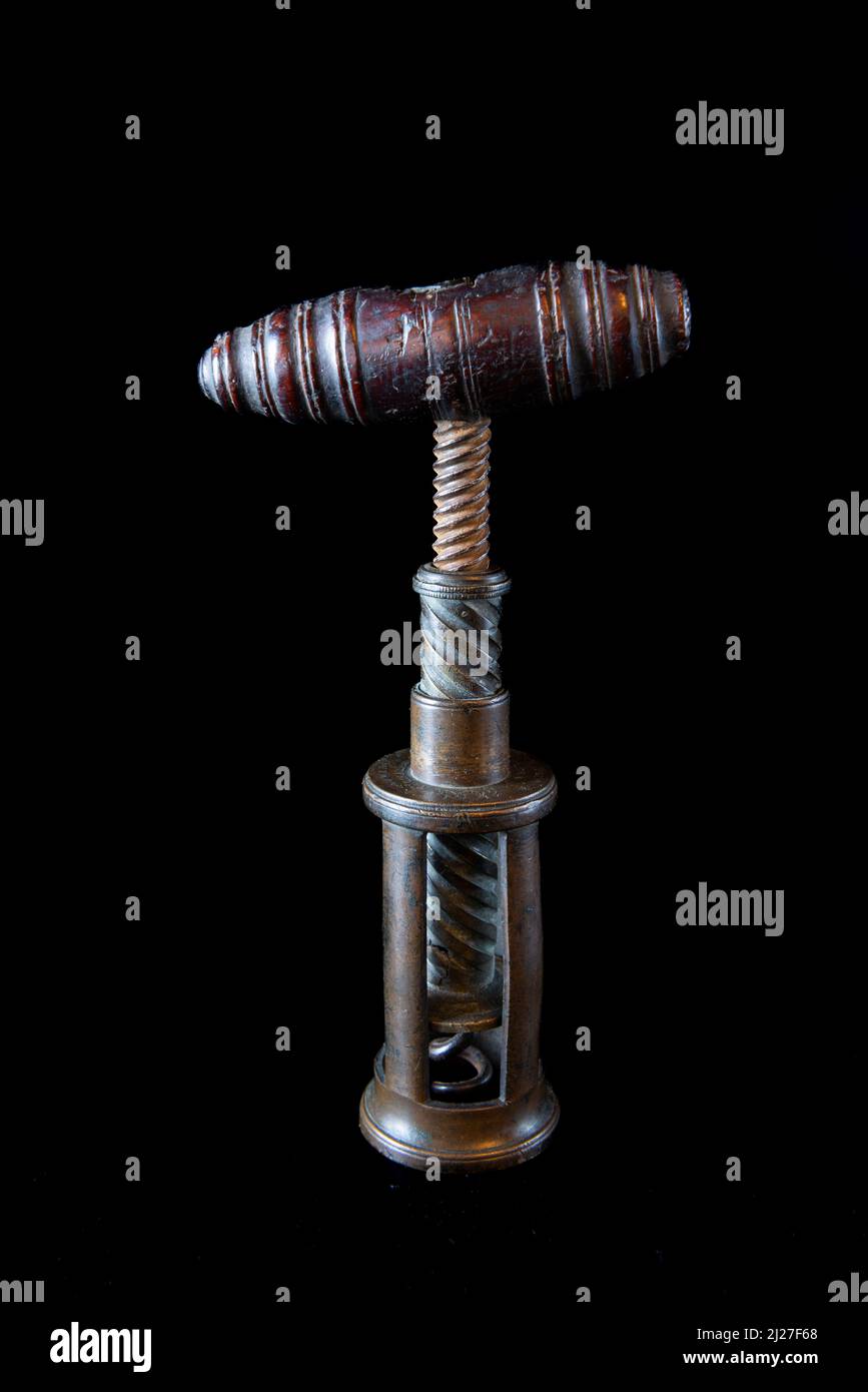 Antique vintage corkscrew on black background Stock Photo - Alamy