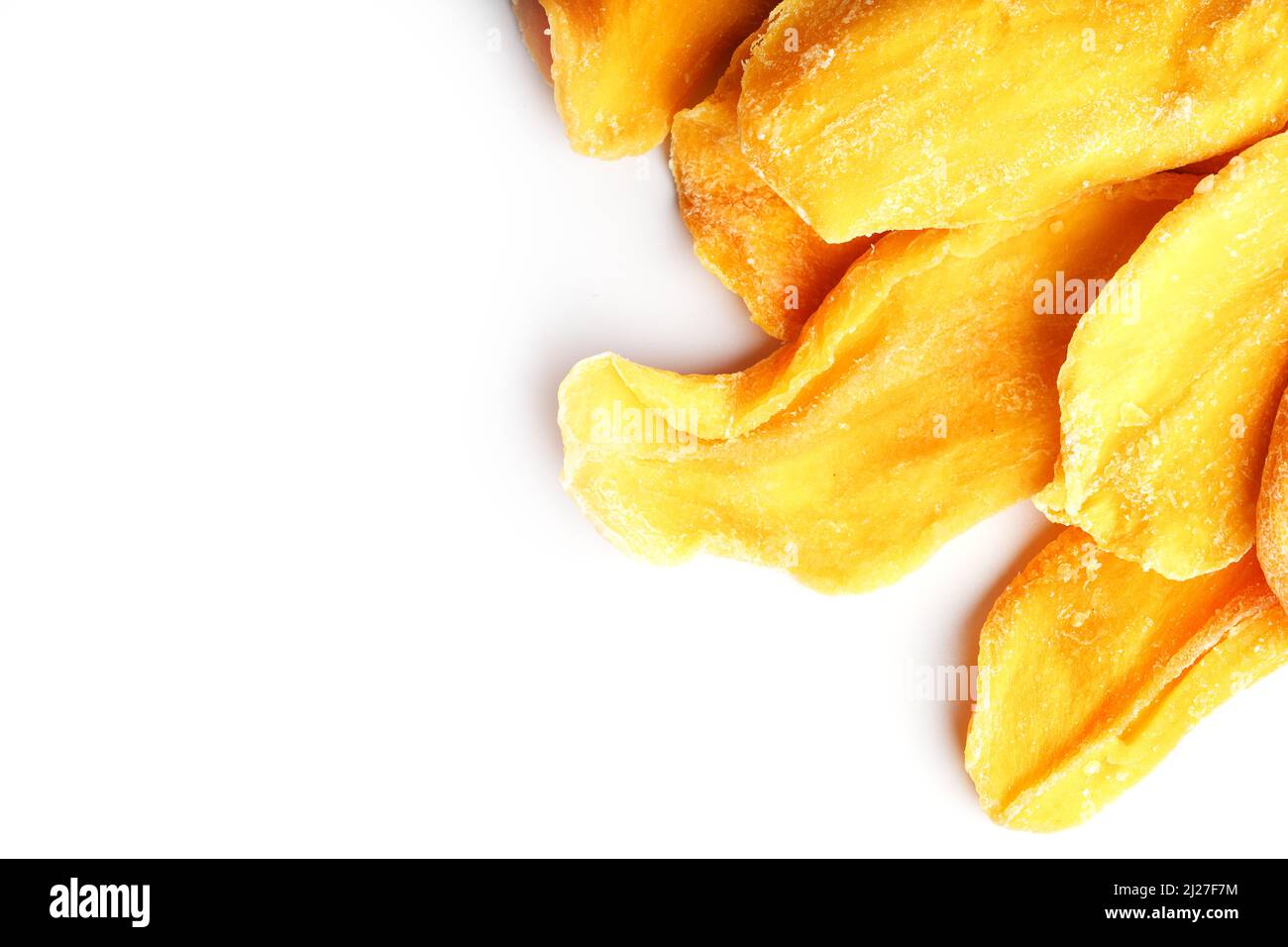 Dried mango sliced on a white background with free space Stock Photo