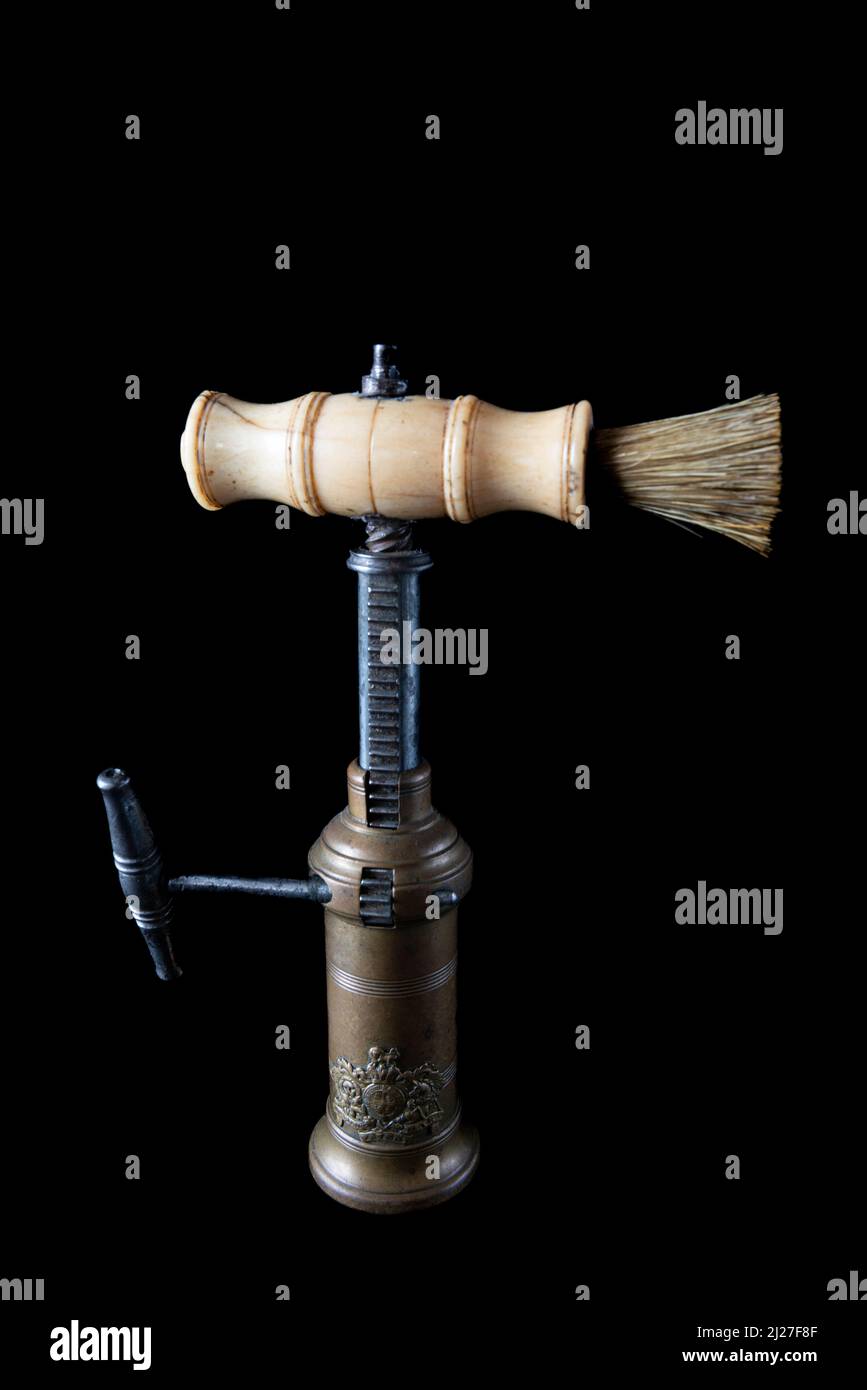 Antique vintage corkscrew on black background Stock Photo - Alamy