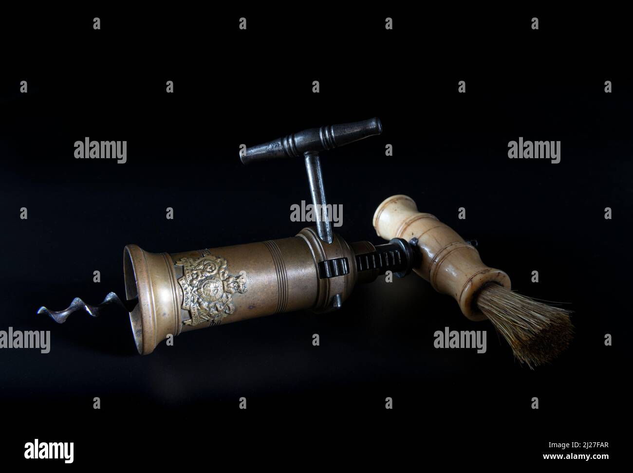 Antique vintage corkscrew on black background Stock Photo