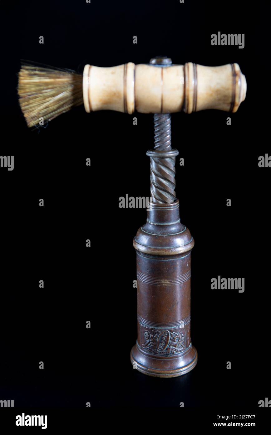 Antique vintage corkscrew on black background Stock Photo