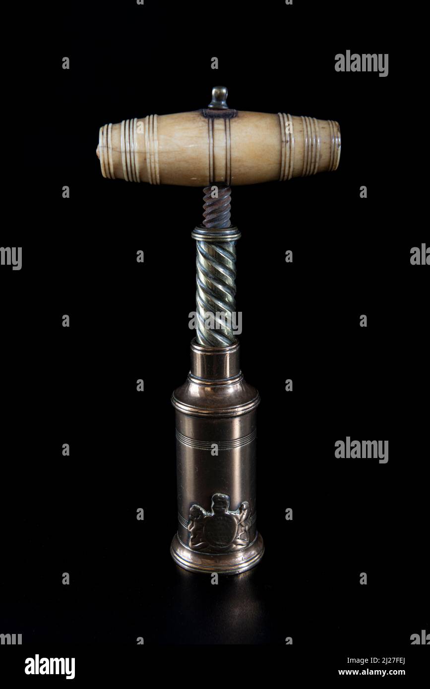Antique vintage corkscrew on black background Stock Photo - Alamy