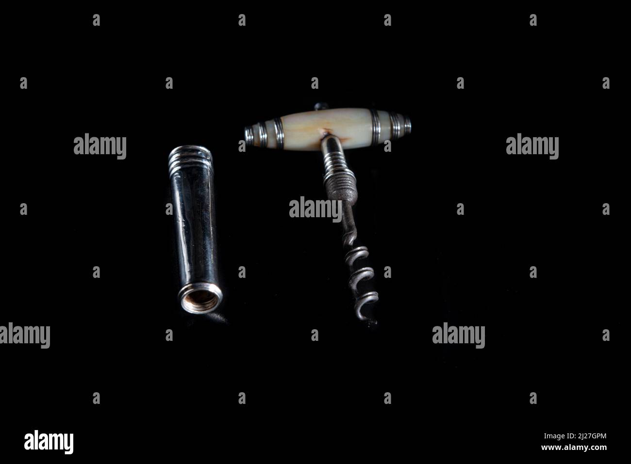 Antique vintage corkscrew on black background Stock Photo - Alamy