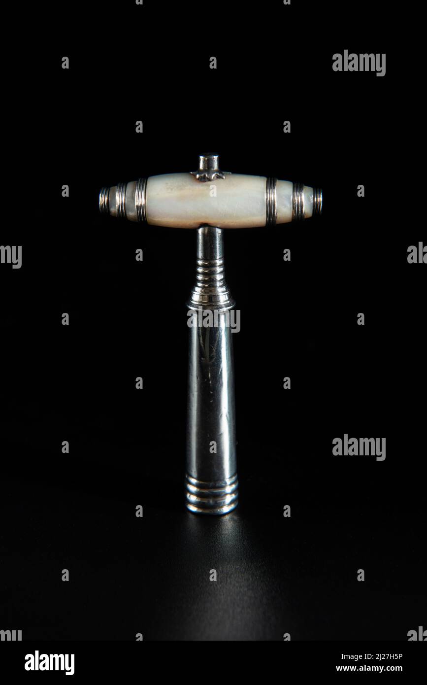 Antique vintage corkscrew on black background Stock Photo - Alamy