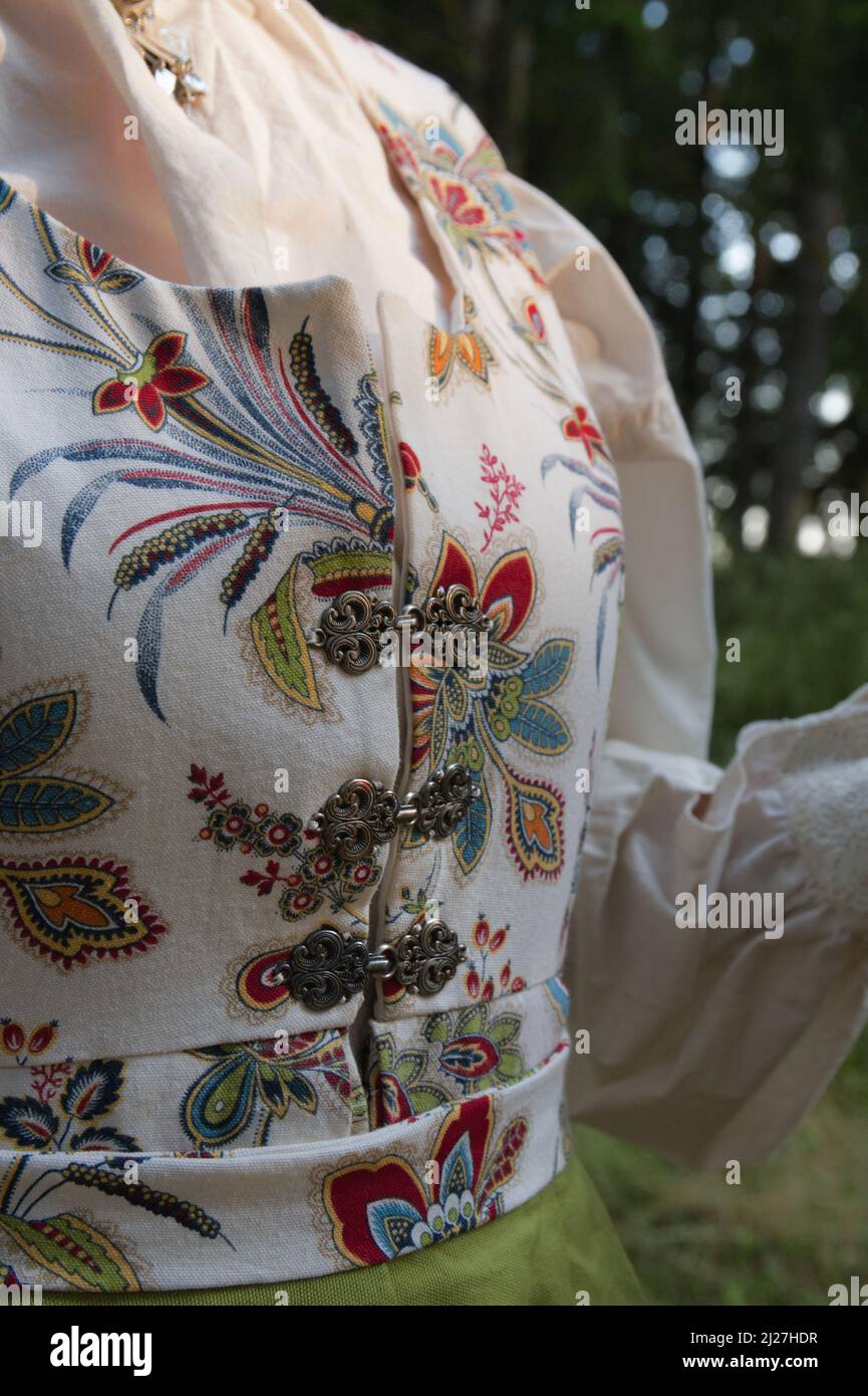 A shot of a traditional dress with patterns of a woman with no face Stock Photo