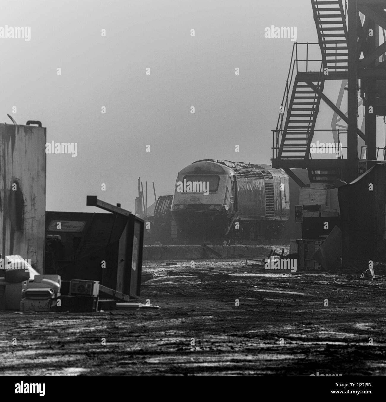 Withdrawn high speed train power car 43053 in the mist at Sims Metals, Newport docks, south Wales waiting to be cut up for scrap Stock Photo