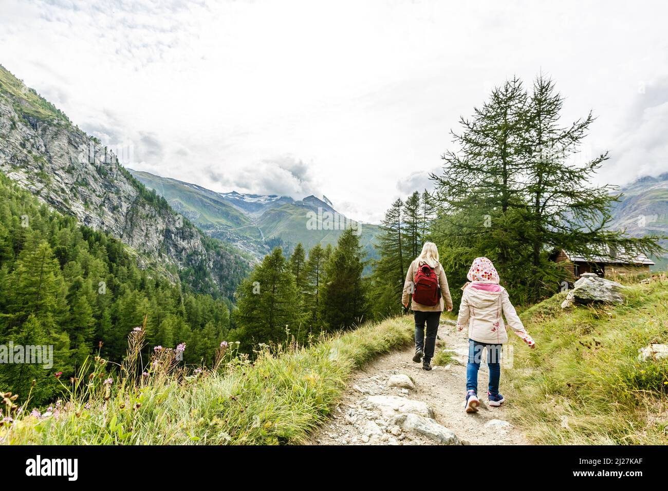 happy family hiking in scenic mountains Stock Photo - Alamy