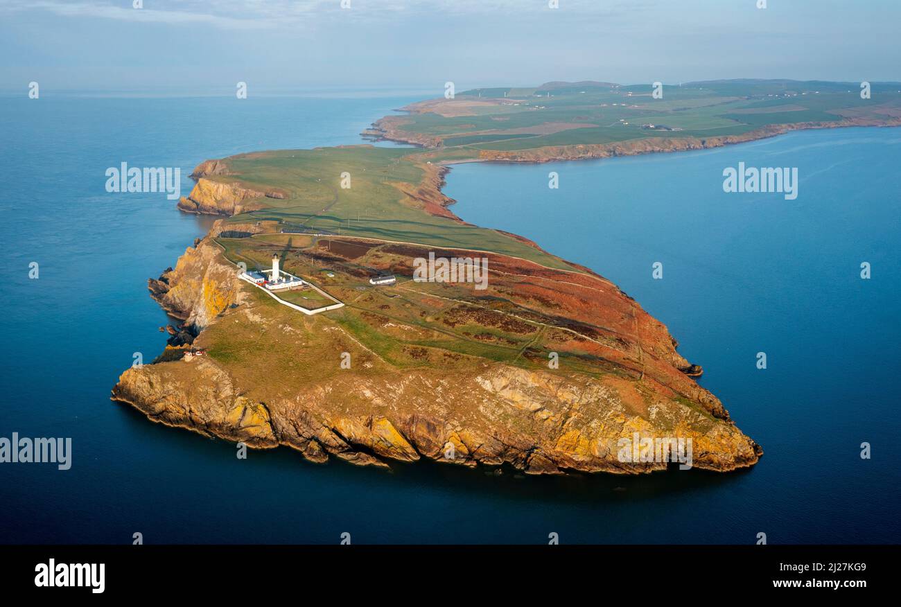 Aerial view at sunrise of Mull of Galloway Lighthouse at southern most point in Scotland, in Dumfries and Galloway, Scotland, UK Stock Photo