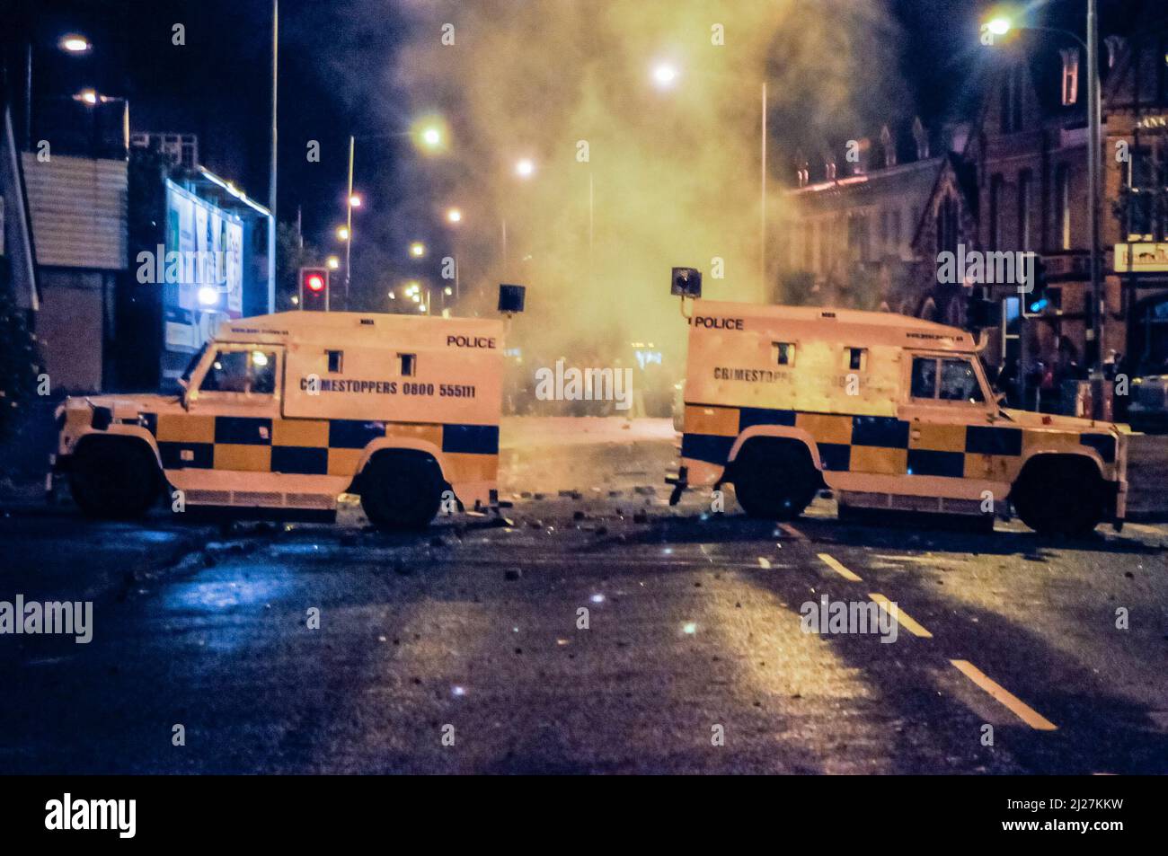 30/09/2009, Belfast, Northern Ireland.  Smoke rises from PSNI landrovers after a small explosive device was thrown during civil unrest at the Short Strand/Castlereagh Street junction in Belfast Stock Photo