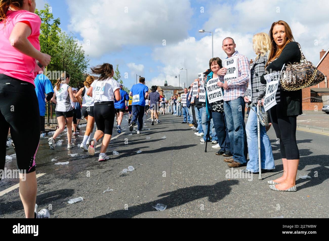 03/05/2010, Belfast, Northern Ireland.  Republicans hold a "White Line Protest" in the middle of the Falls Road during the annual Belfast Marathon, calling for the end of prison brutality at HMP Maghaberry. Stock Photo