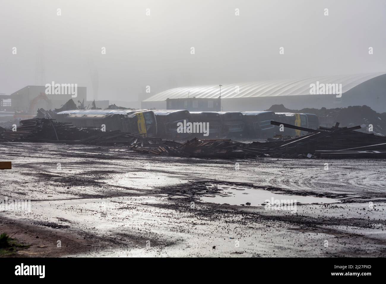 Withdrawn class 365 electric commuter trains on their sides waiting to be cut up for scrap at SIMS metals, Newport docks total destruction order. Stock Photo