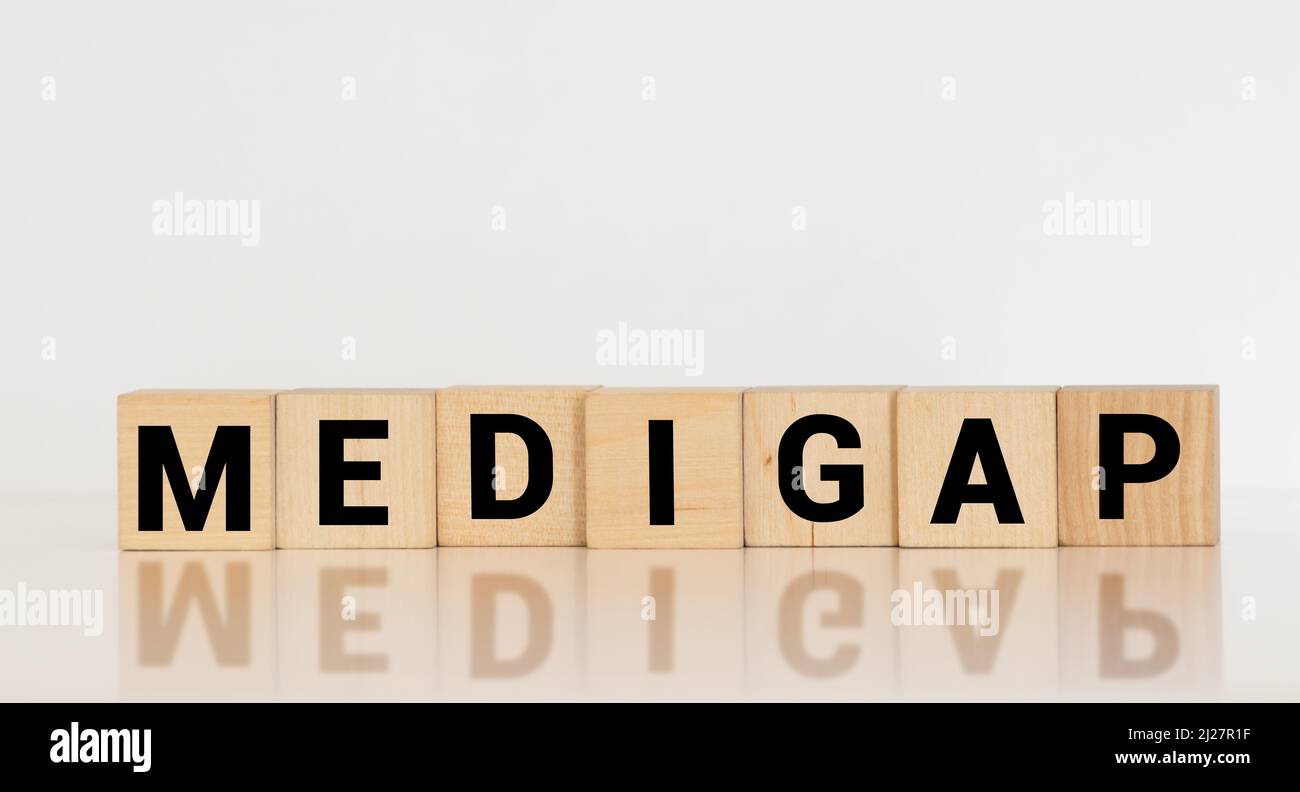Word Medigap made with wood building blocks. Stock Photo