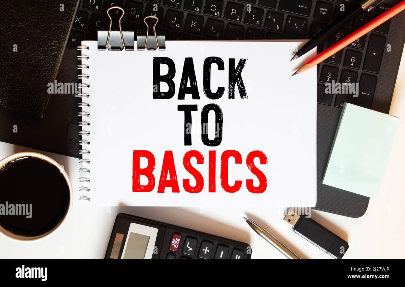 Business concept. Notebook with text BACK TO BASIC sheet of white paper ...
