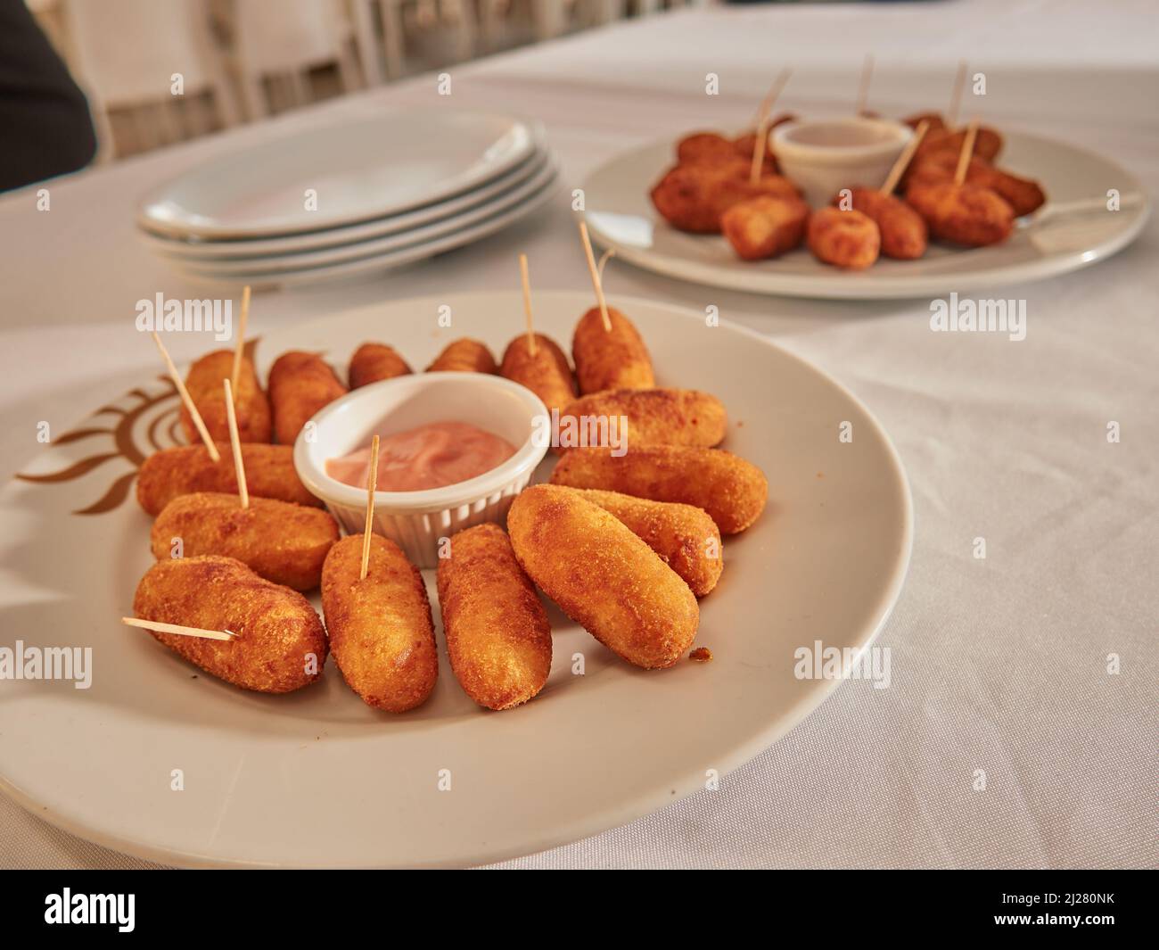 Gourmet wedding dinner on the beach eating tasty pastas and meats Stock