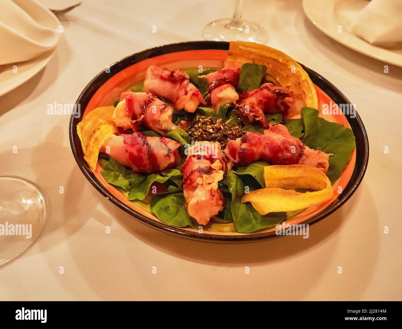 Gourmet wedding dinner on the beach eating tasty pastas and meats Stock