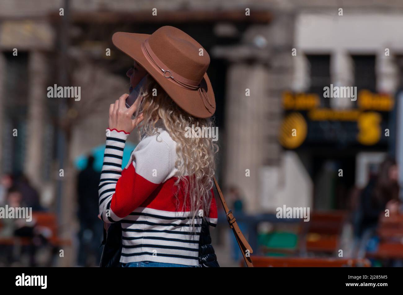 Talking on the phone rear view hi-res stock photography and images - Alamy