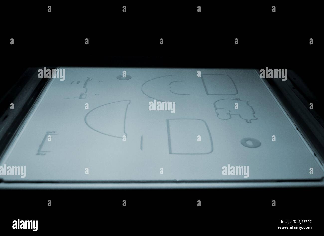 Powder 3D printer printing models from white powder polyamide closeup