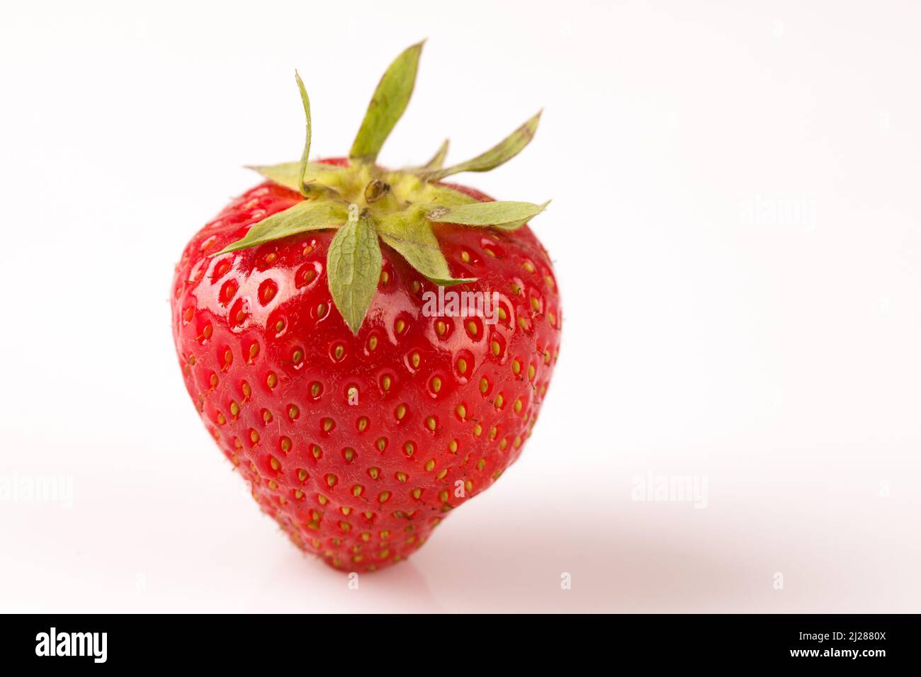 A closeup shot of fresh and ripe strawberry isolated on a white ...