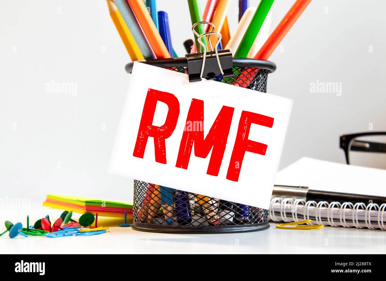 Businessman hand with pen pointing to RMF sign on the paper Stock Photo