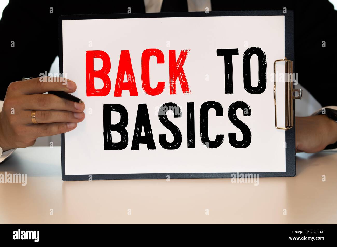 Business concept. Notebook with text BACK TO BASIC sheet of white paper ...