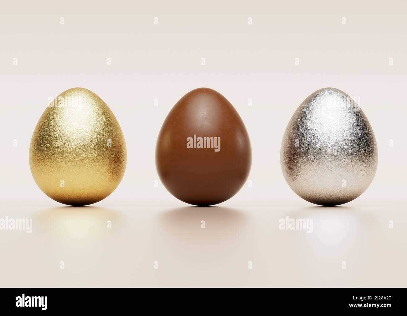 Milk chocolate easter eggs with gold and silver Aluminium foil on pale