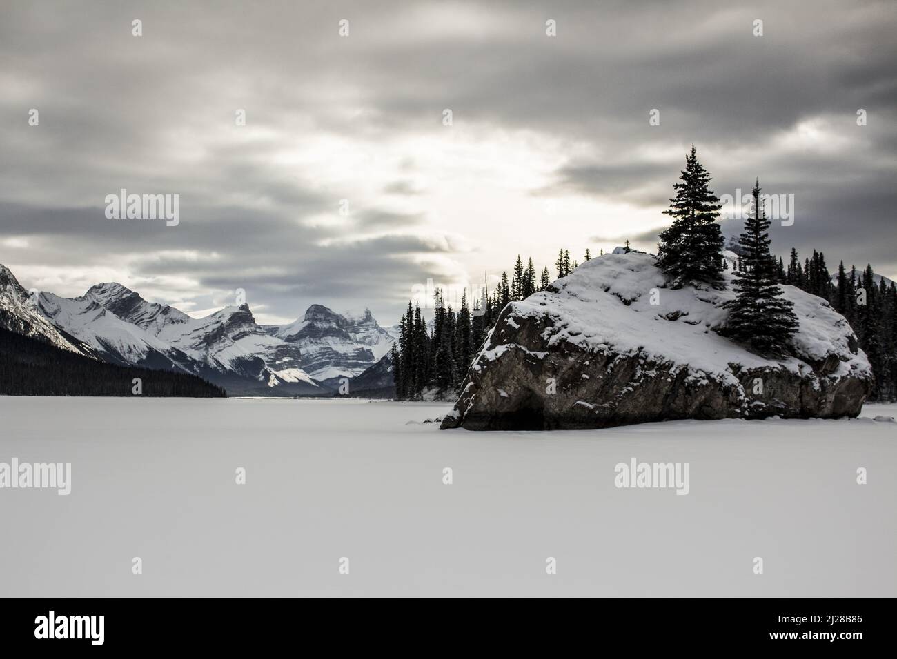 A beautiful winter landscape with the frozen Maligne Lake, Jasper