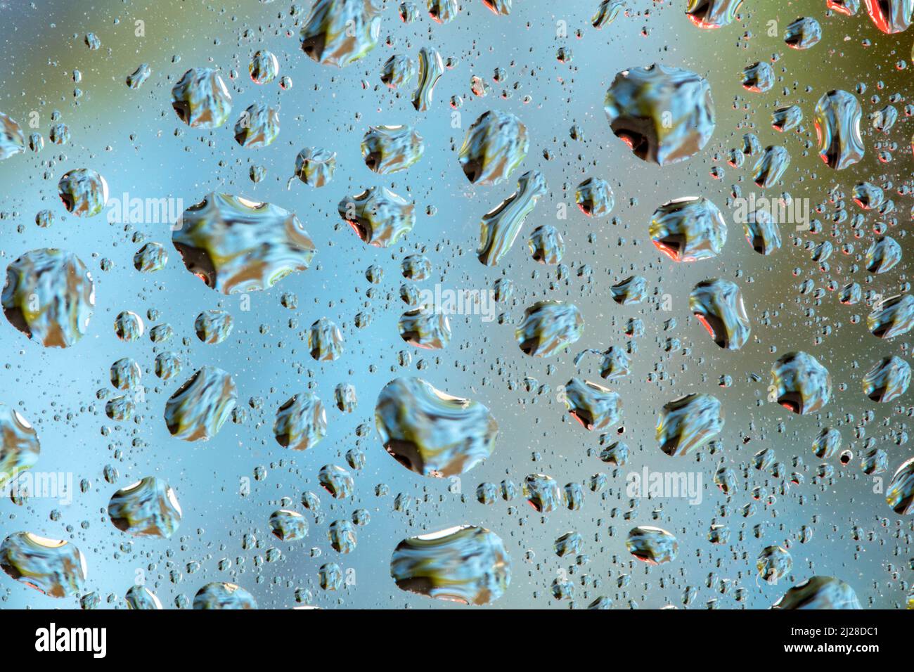 Waterdrops Inverted Abstract irregular water drops macro showing reflected colours Stock ...