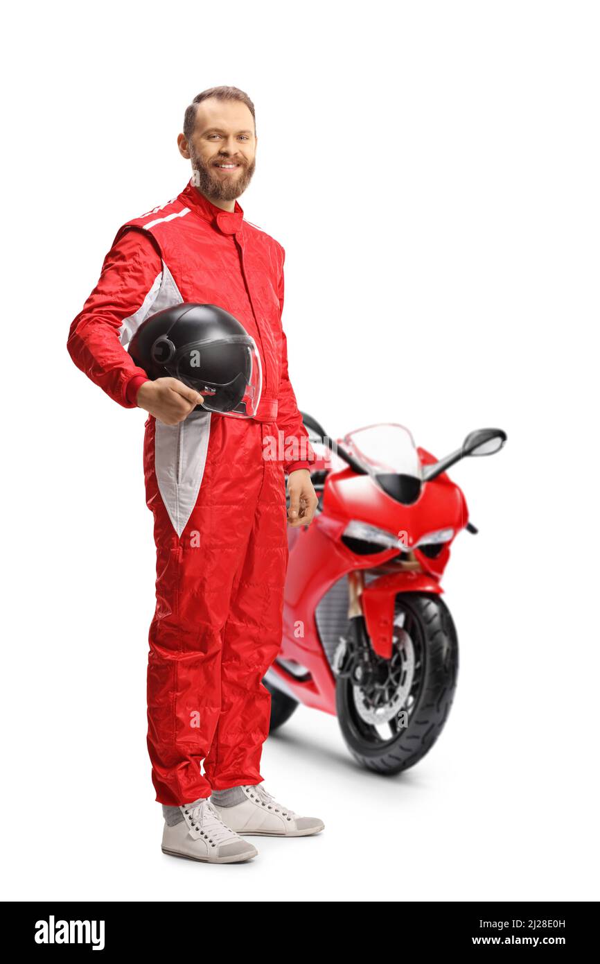 Motorbike racer holding a helmet and smiling with a red bike isolated on white background Stock Photo