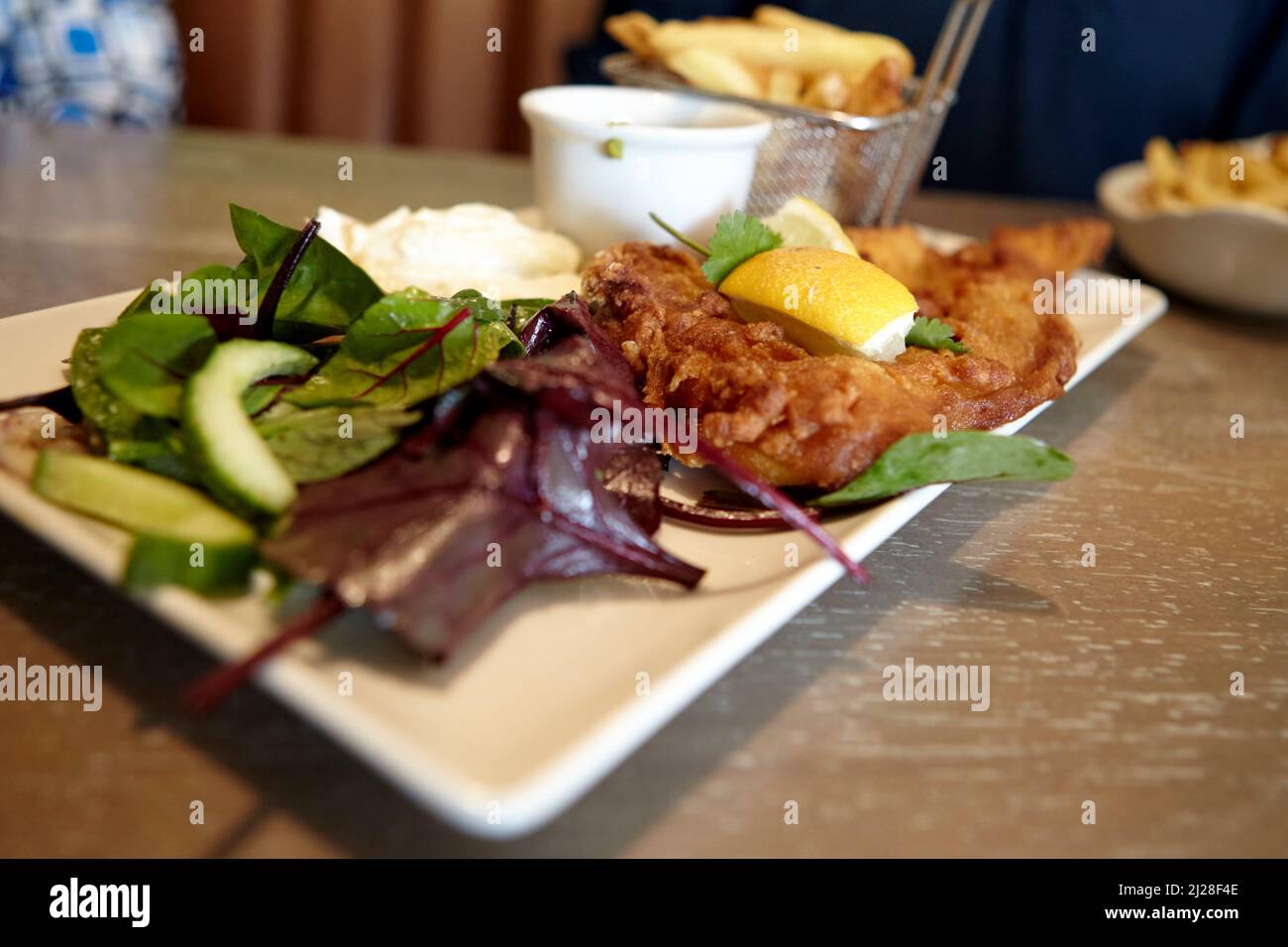 fish and chips in gastropub the cobblers bar westport county mayo republic of ireland Stock Photo