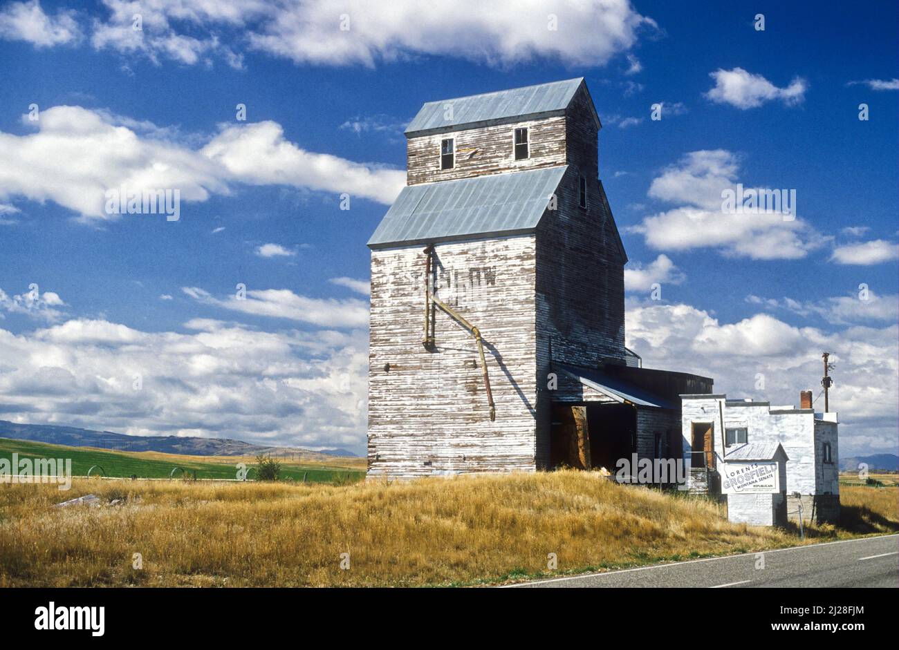 An old, wooden grain elevator in a remote area of Montana, north of Yellowstone National Park Stock Photo
