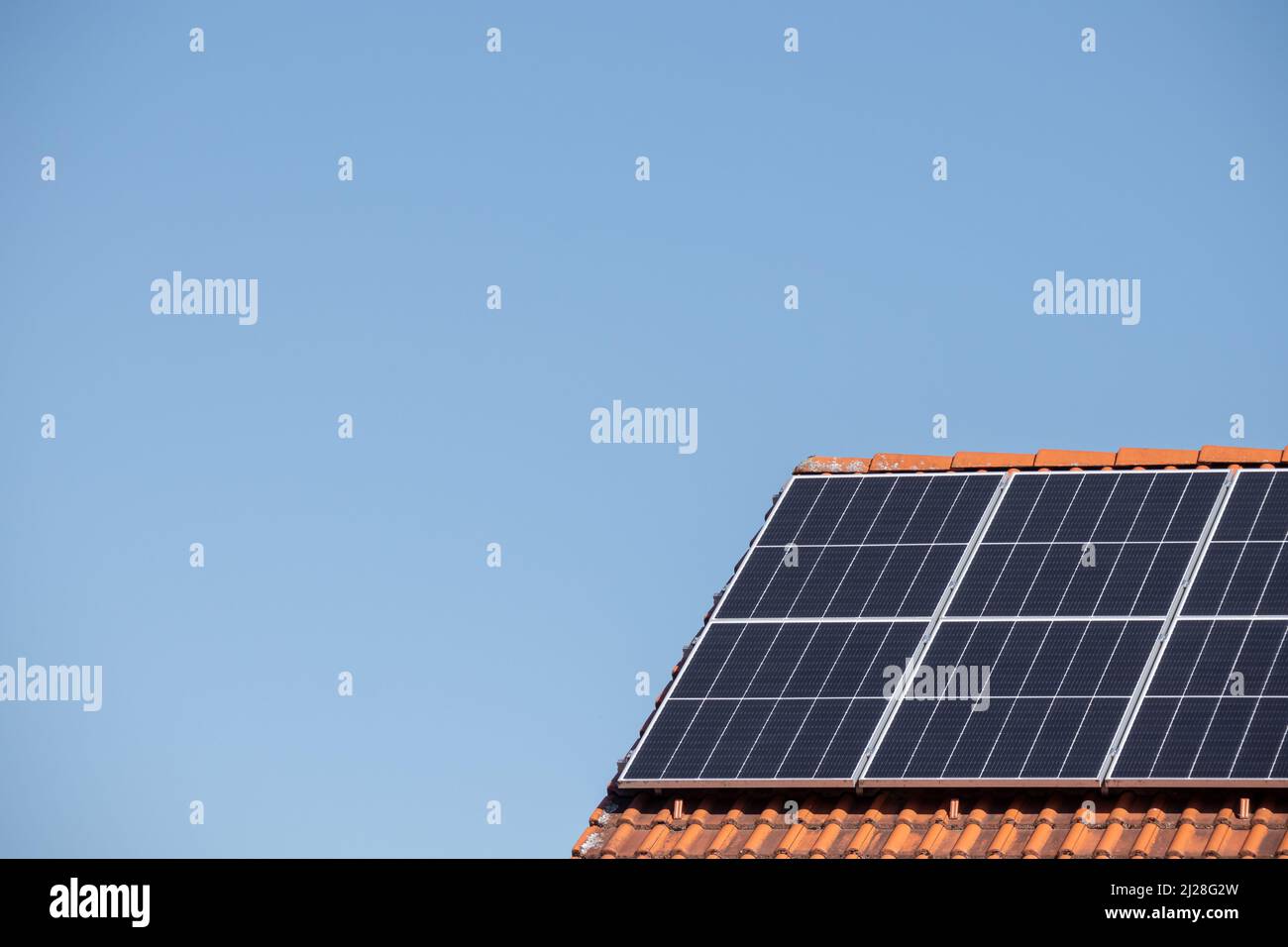 Solar photovoltaic panels on a house roof for renewable energy with ...