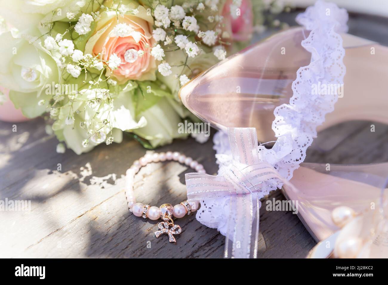 Feminine pink and white bridal details close-up outdoors Stock Photo