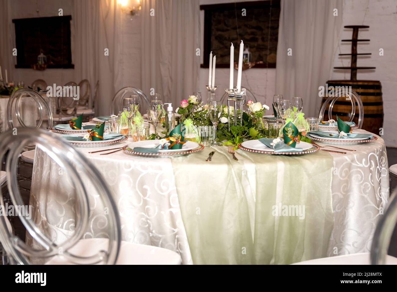 Green and Gold Theme Table setting and decorations Stock Photo