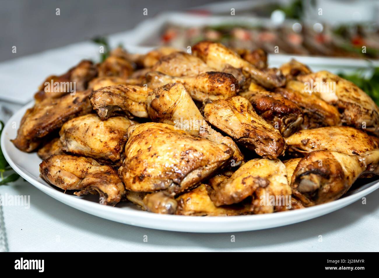 Roasted meat cold cut slices on a white platter Stock Photo