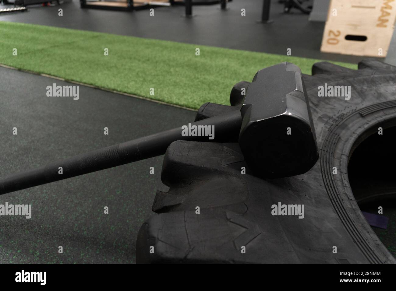 Sledgehammer training wheel active physical, in the afternoon sledge strong for muscular for fitness concentration, exercise energy. Huge power Stock Photo