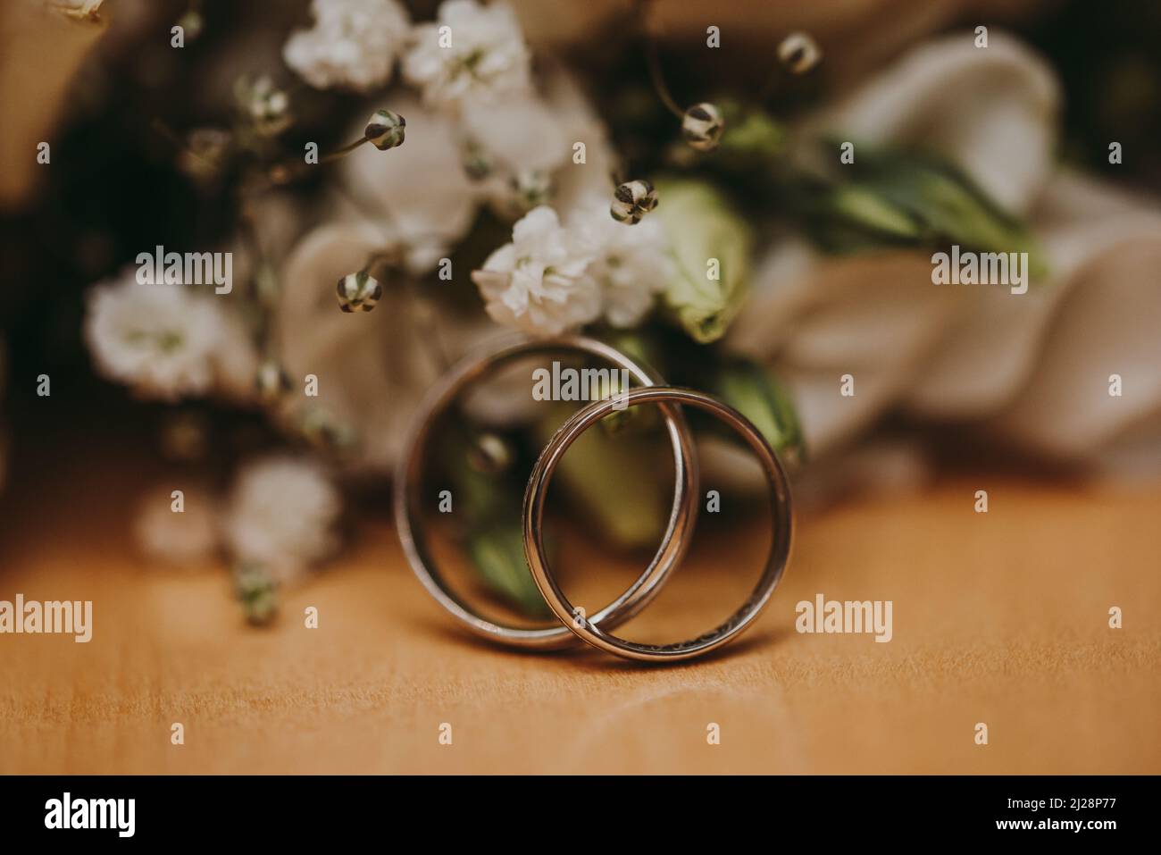 wedding rings with bouquet close up Stock Photo