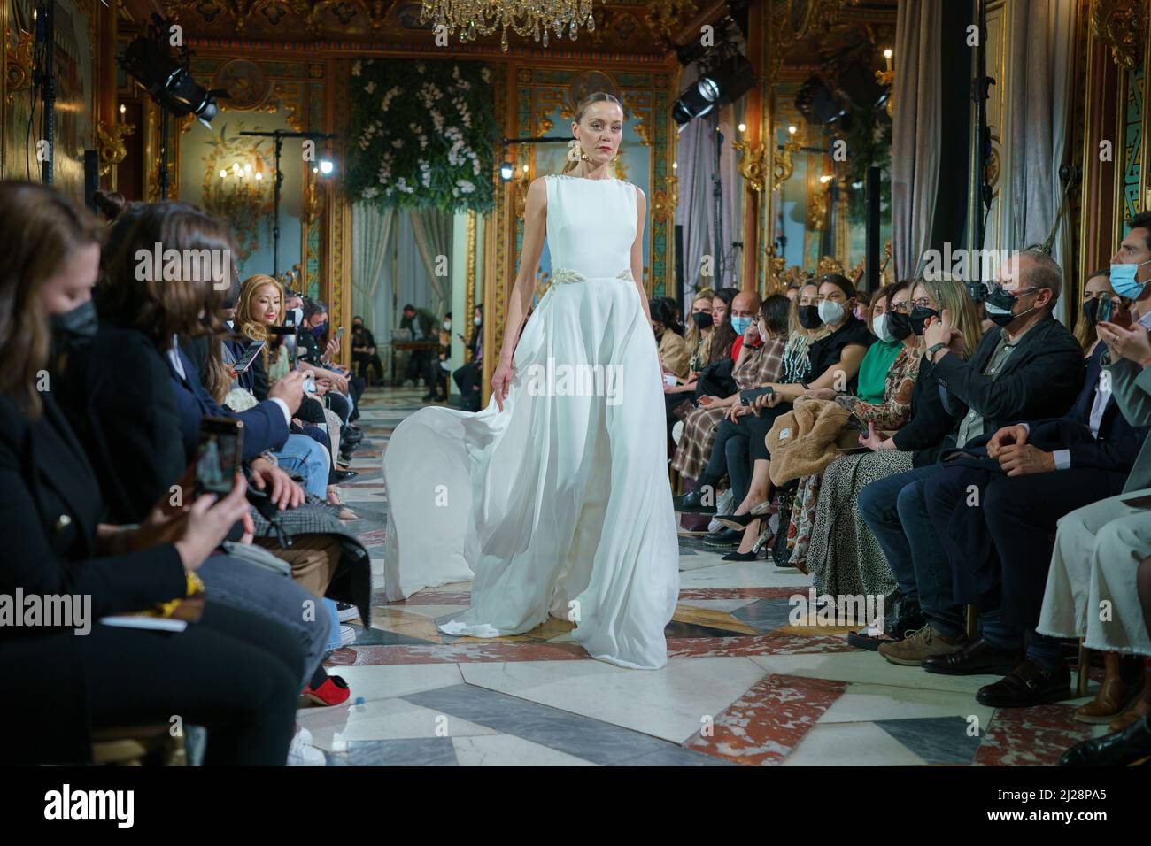 Madrid, Spain. 30th Mar, 2022. A model showcases Lorena Merino design  during the Atelier Couture bridal catwalk within Madrid Fashion Week, held  at the Santonia Palace in Madrid. Credit: SOPA Images Limited/Alamy