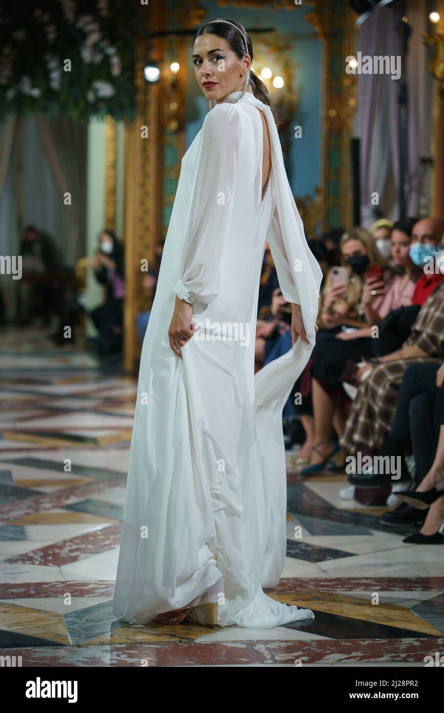 Madrid, Spain. 30th Mar, 2022. A model showcases Lorena Merino design  during the Atelier Couture bridal catwalk within Madrid Fashion Week, held  at the Santonia Palace in Madrid. Credit: SOPA Images Limited/Alamy