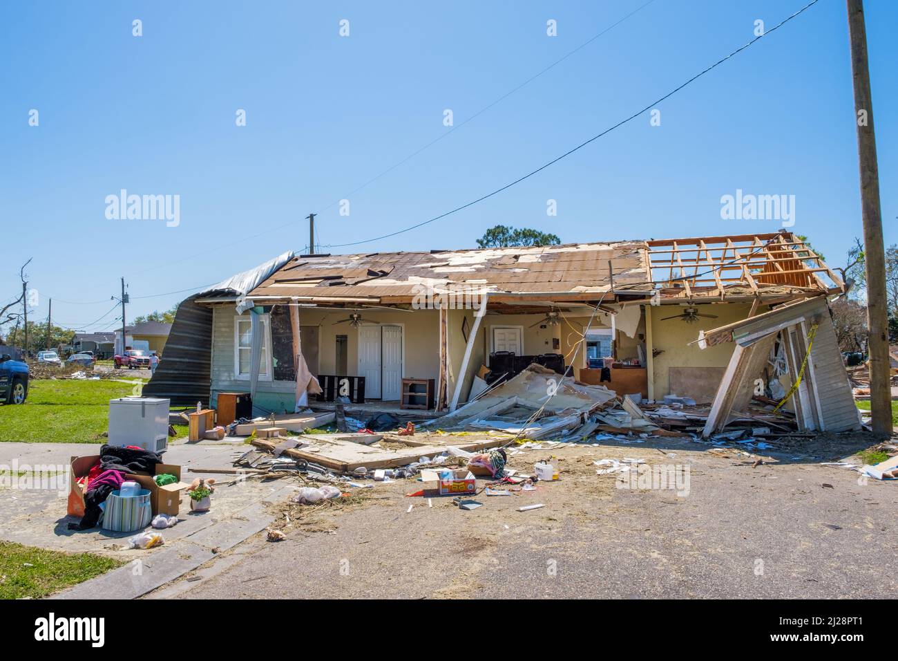 ARABI, LA, USA - MARCH 26, 2022: House shattered by tornado on March 22, 2022 and pushed in the middle of the street. Stock Photo
