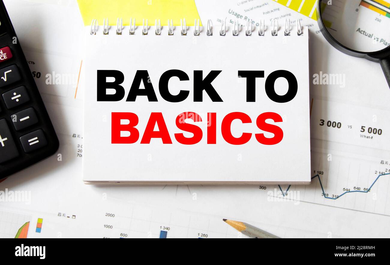 Business concept. Notebook with text BACK TO BASIC sheet of white paper ...