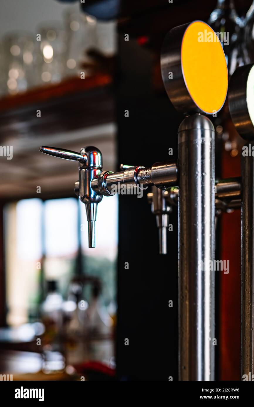 https://c8.alamy.com/comp/2J28RW6/detail-of-two-beer-dispensers-apparatus-for-dispensing-beer-in-the-bar-drops-of-water-on-metal-2J28RW6.jpg