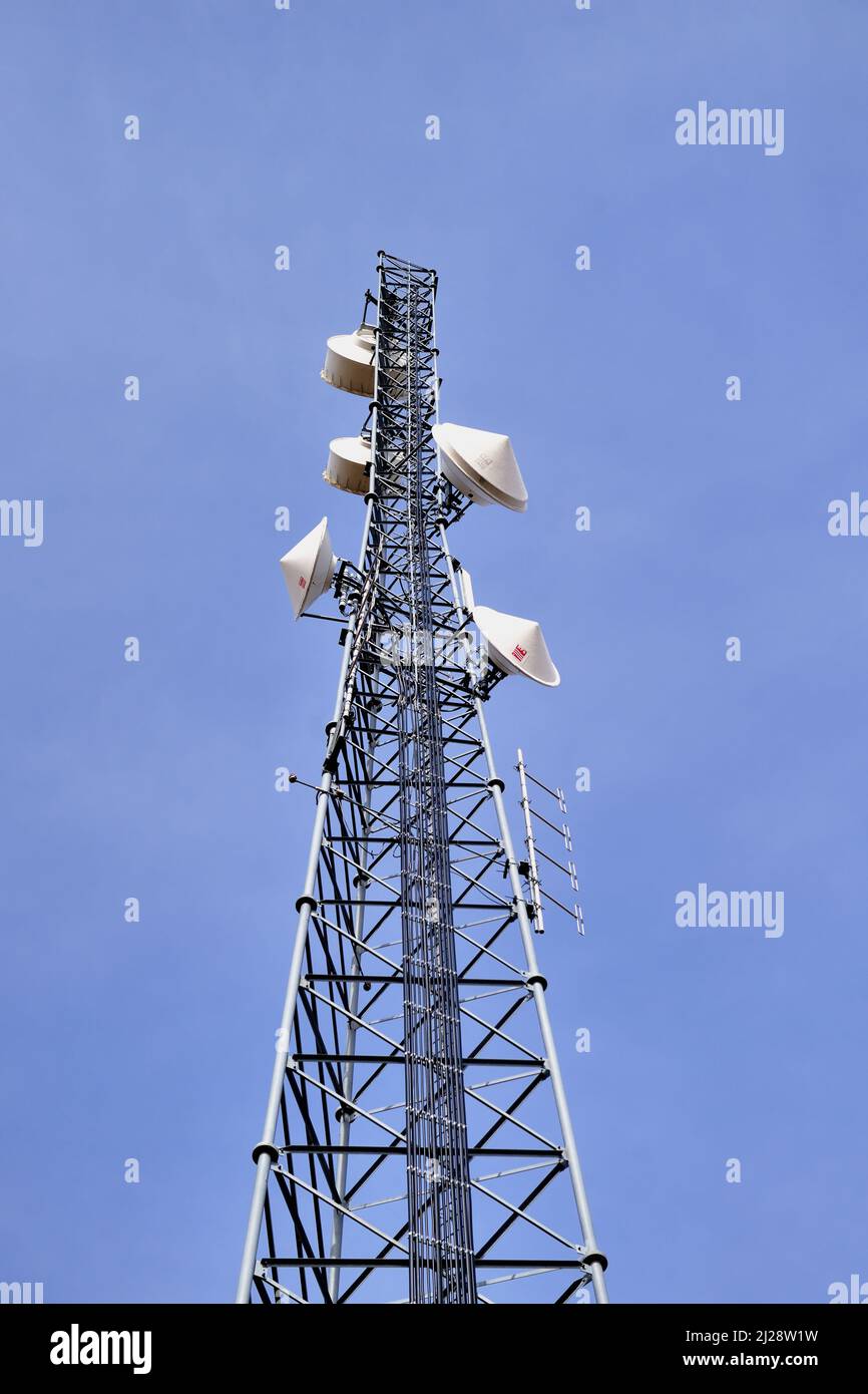 Wayne, Illinois, USA. A modern cell tower rigged with multiple devices and modules to provide necessary technology for communication. Stock Photo