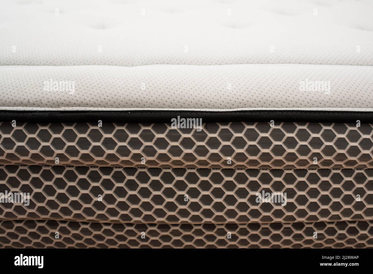 Detail of the spongy material of the upper fabric of a mattress for