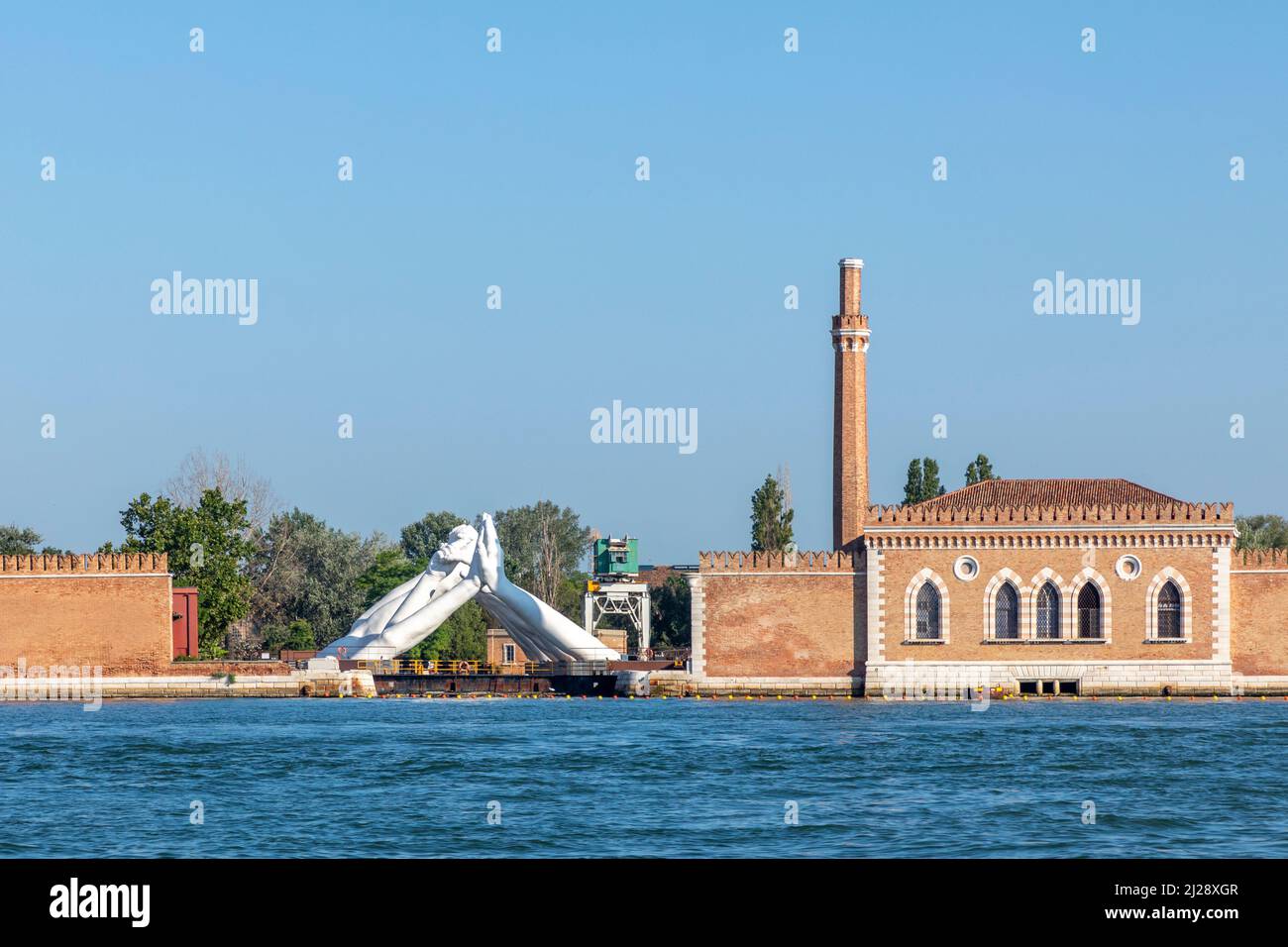 Venice, Italy - July 6, 2021: Lorenzo Quinn's Giant Stone Hands Represent Humanity’s Universal Values At Venice Art Biennale in Venice, Italy. Stock Photo